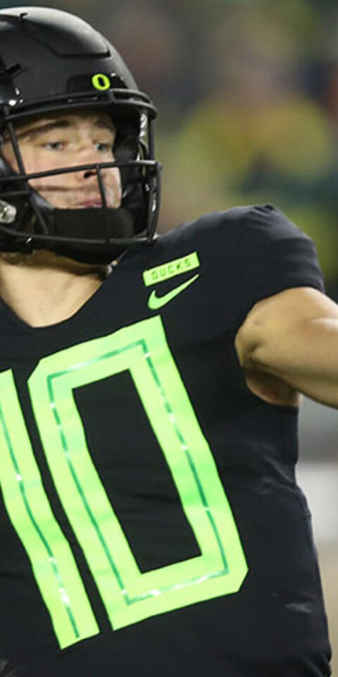 This Nov. 17, 2018, file photo shows Oregon quarterback Justin Herbert throwing down field against Arizona State during the first quarter of an NCAA college football game in Eugene, Ore