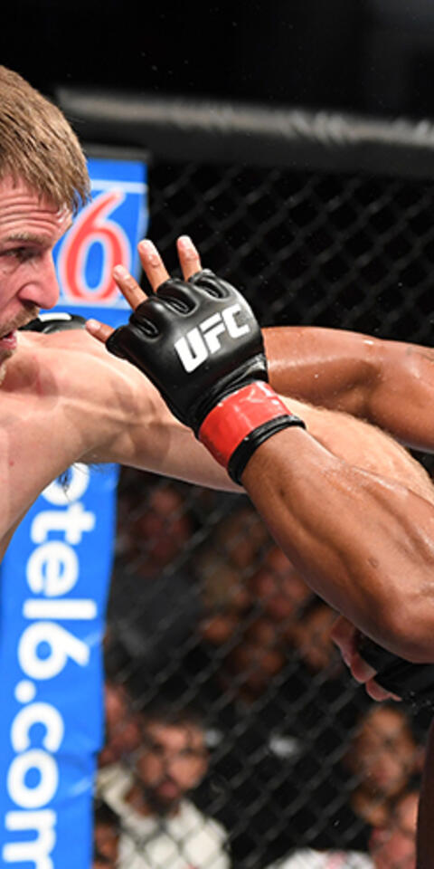 Stipe Miocic and Daniel Cormier fighting at UFC 241. MMA oddsmakers have Cormier as the favorite in the third match between the two fighters.