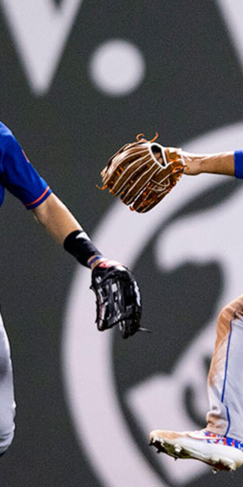 Brandon Nimmo #9, Michael Conforto #30, and Jake Marisnick #16 of the New York Mets celebrate a victory over the Boston Red Sox.