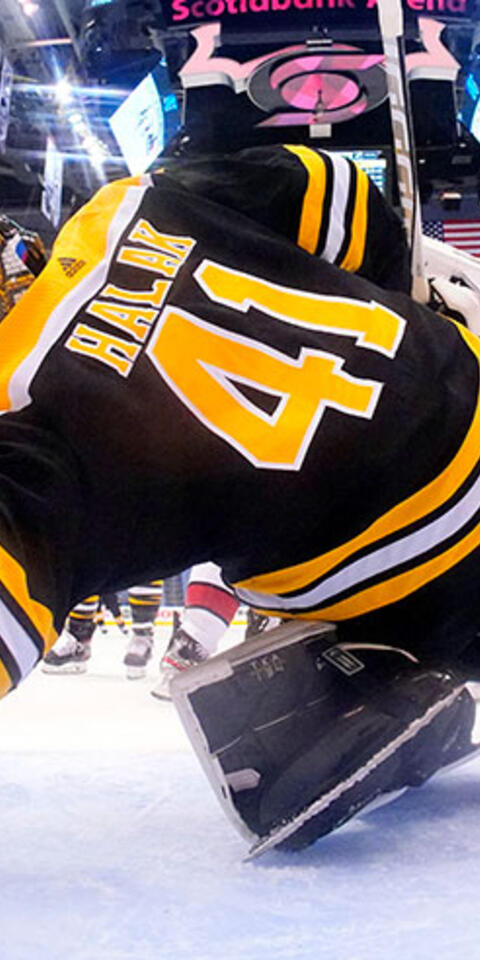 Goaltender Jaroslav Halak #41 of the Boston Bruins stretches to make the save on the Carolina Hurricanes during the first period of Game Five of the Eastern Conference First Round.