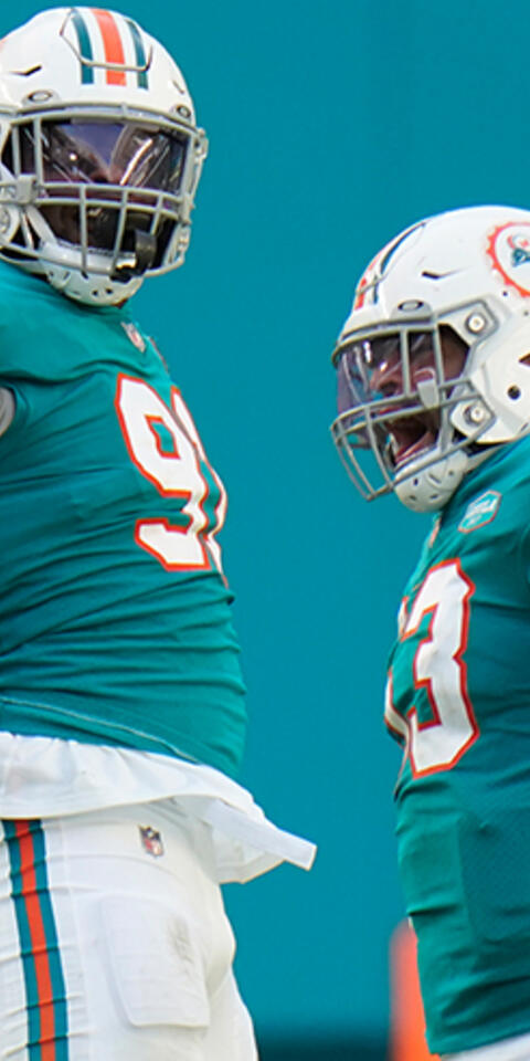 Miami Dolphins middle linebacker Kyle Van Noy (53) celebrates with defensive end Emmanuel Ogbah (91) after Ogbah sacked New England Patriots quarterback Cam Newton during an NFL football game on Dec. 20, 2020, in Miami Gardens, Fla.