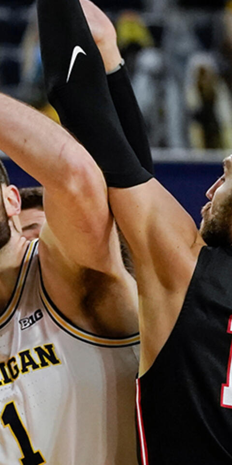 Michigan center Hunter Dickinson (1) tries to shoot over Ball State forward Brachen Hazen (12) in an NCAA college basketball game in Ann Arbor, Mich., on Dec. 2, 2020.